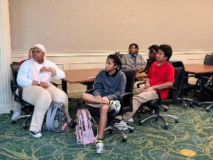 Group of students watching Marks presentation